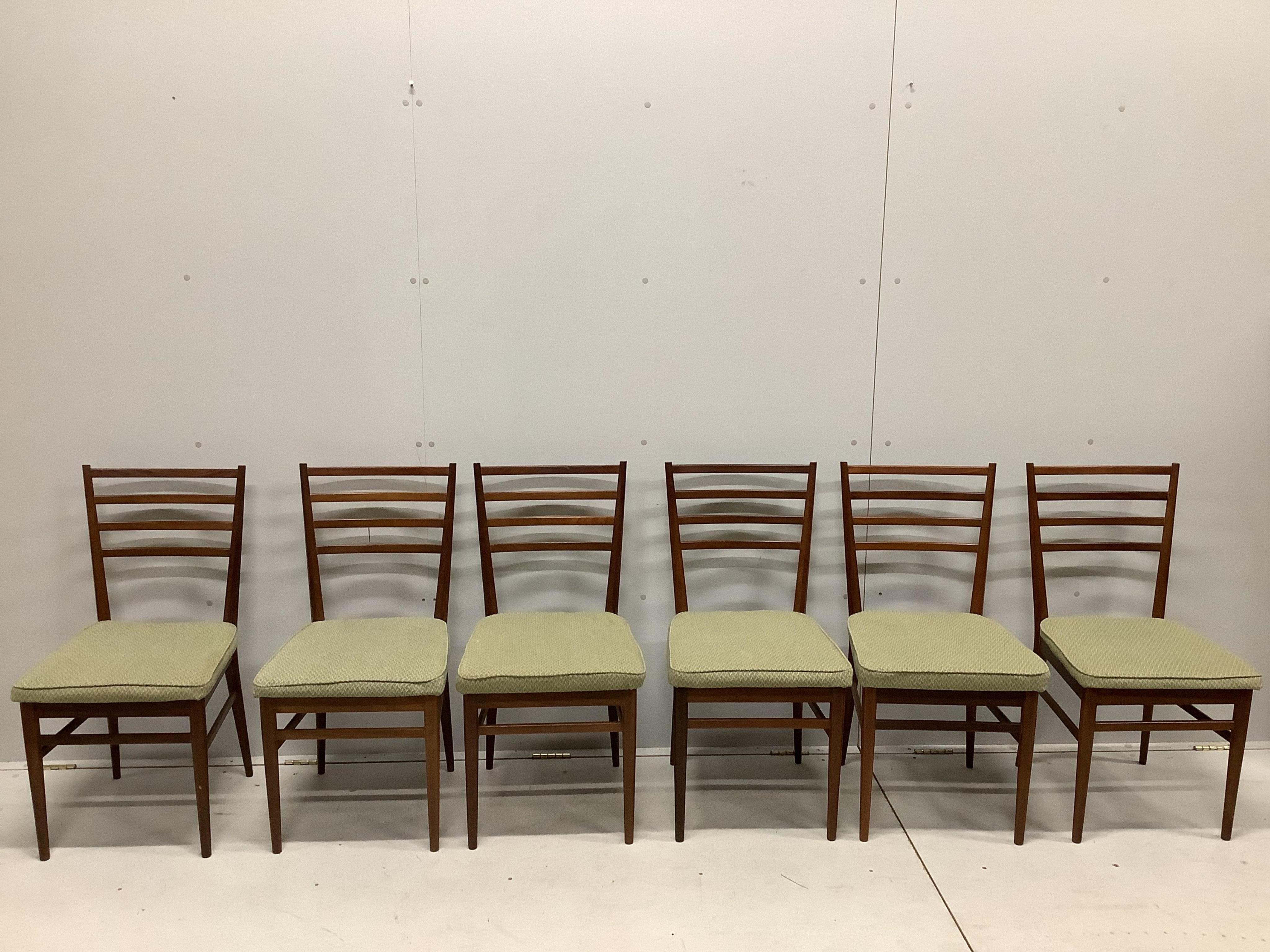 A mid century Meredew Furniture rectangular teak extending dining table and six chairs, table 206cm extended, one spare leaf, depth 84cm, height 75cm. Condition - fair.